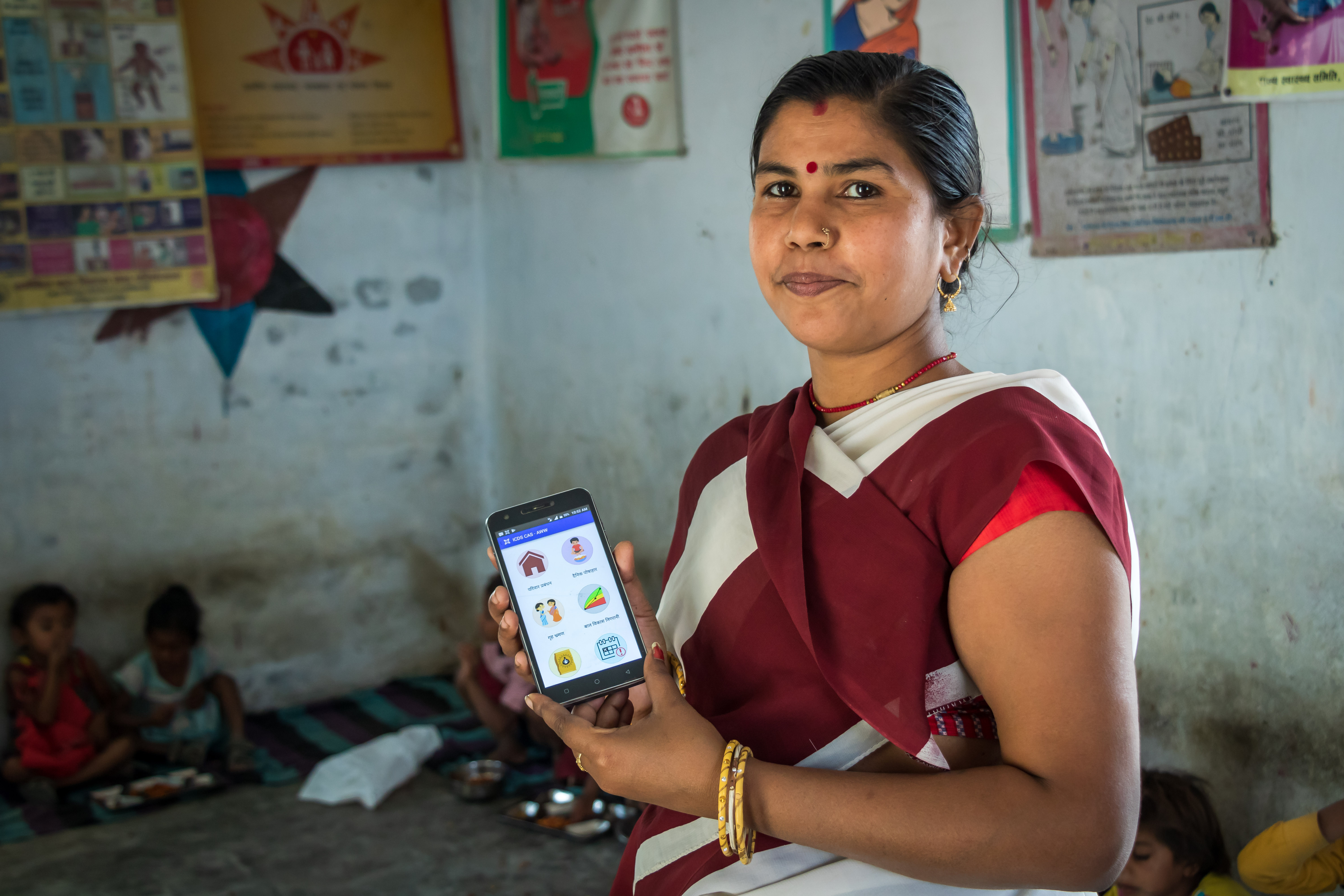 Community Health Worker using a phone