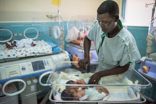 Provider attending to newborn babies