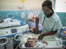 Provider attending to newborn babies